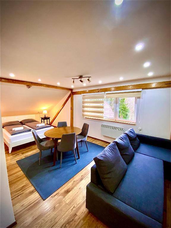 Room with dining area and sofa